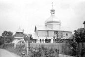 1990 р. Дзвіниця і церква. Вигляд з…