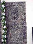 Надгробна плита справа від…